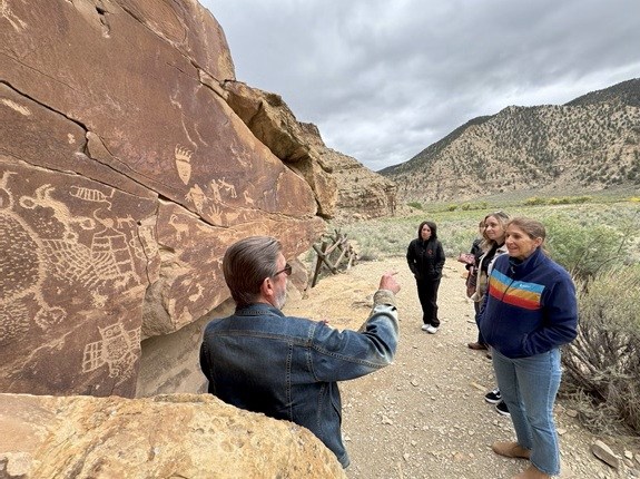 Guide talk of petroglyphs with group