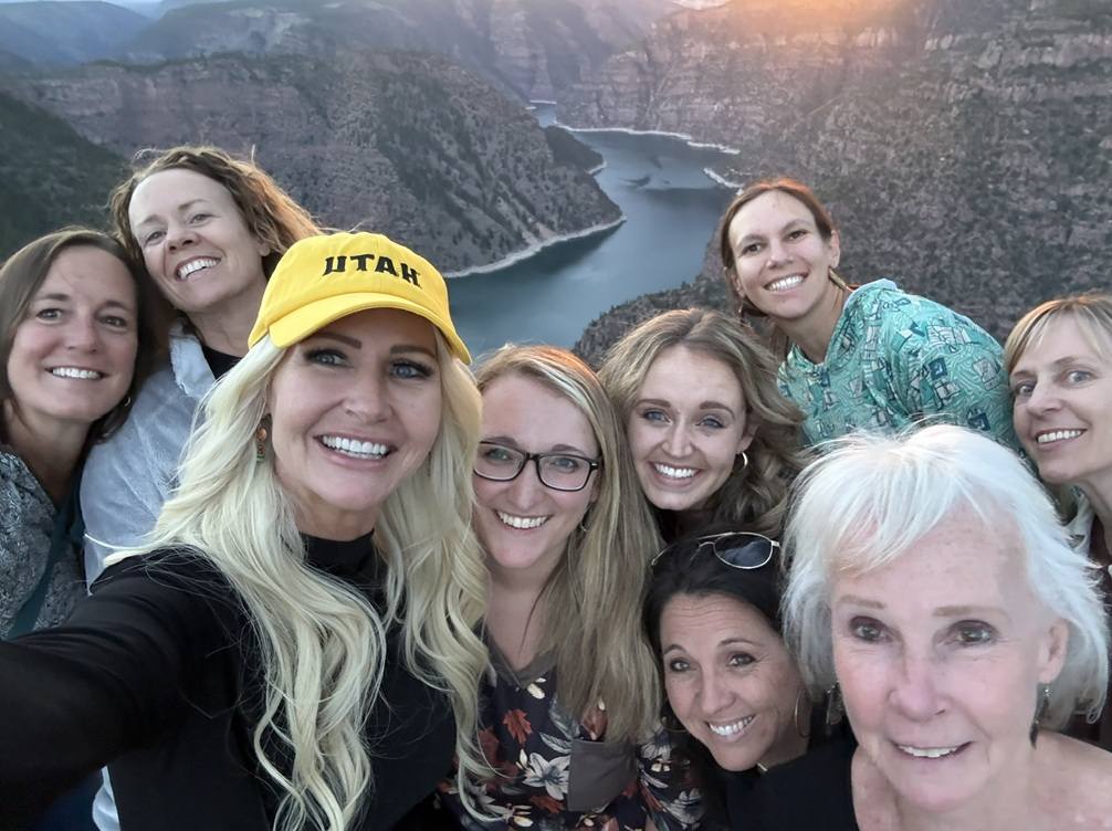Group of women on overlook of reservoir