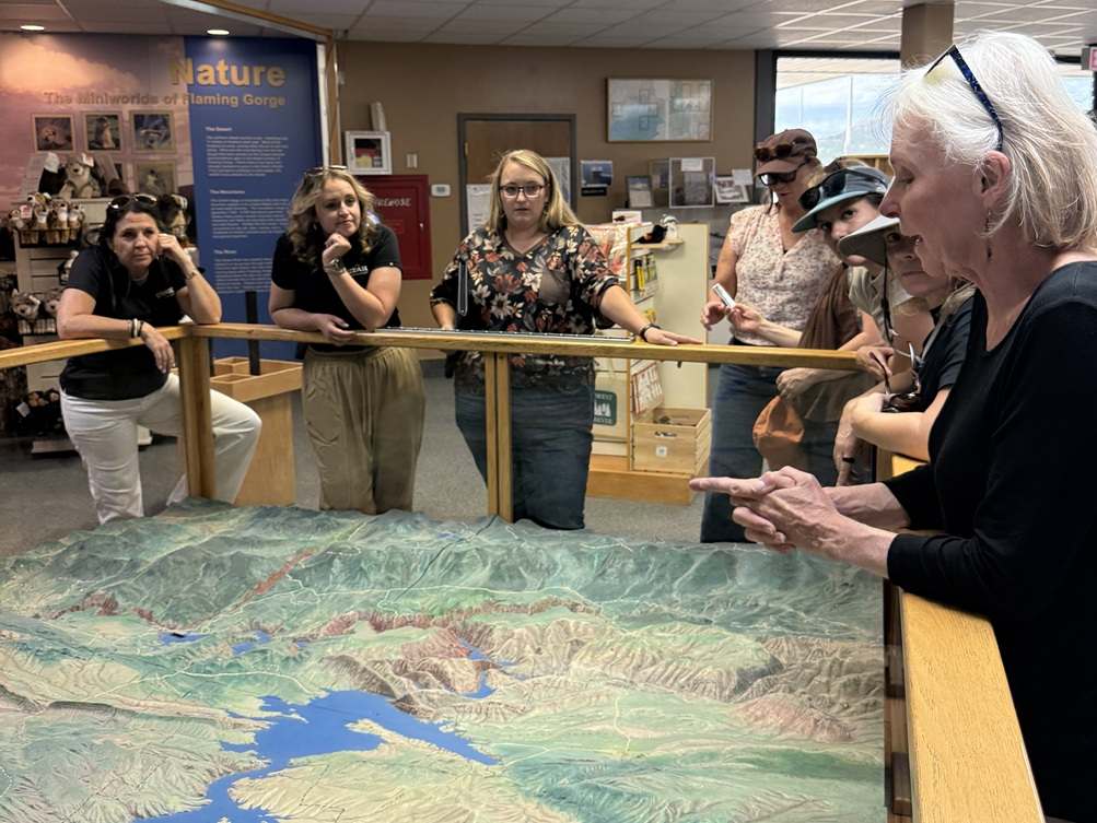 Group of women looking at reservoir exhibit