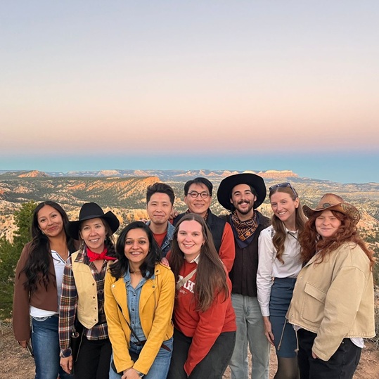 Group of Global Markets and international representatives at Bryce Canyon overlook at sunset