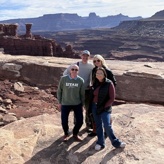 Group of people with red rock canyon in background