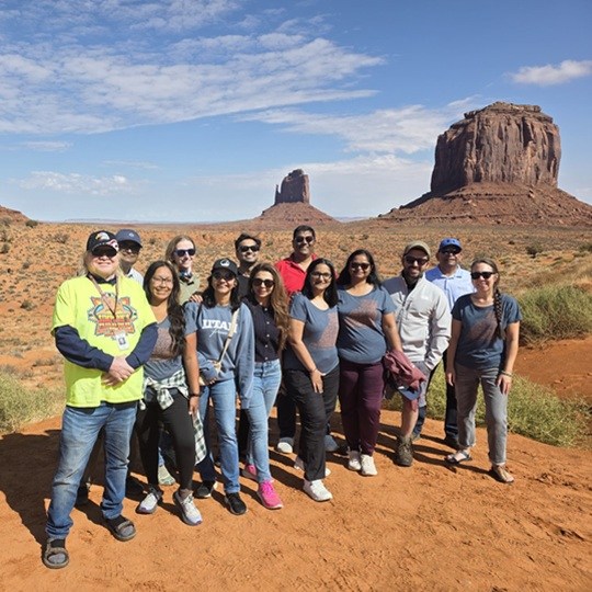 Group with red rock formations in background