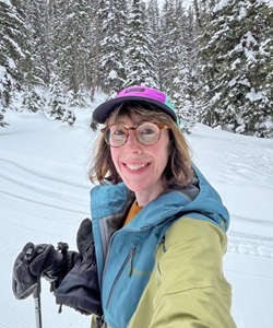 Woman selfie on snow covered mountain