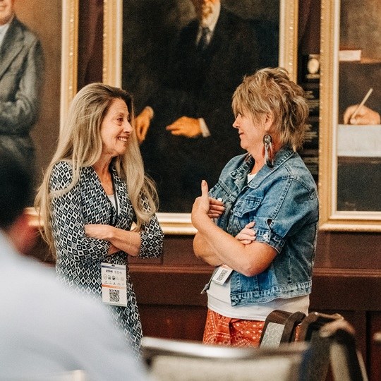 Two women talking with each other