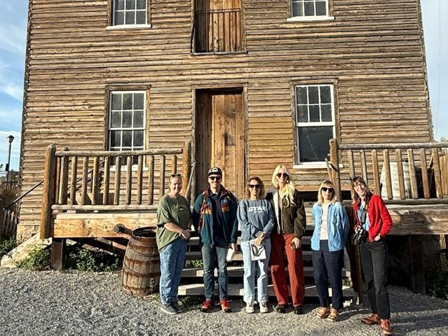 Group in front of historic buildling